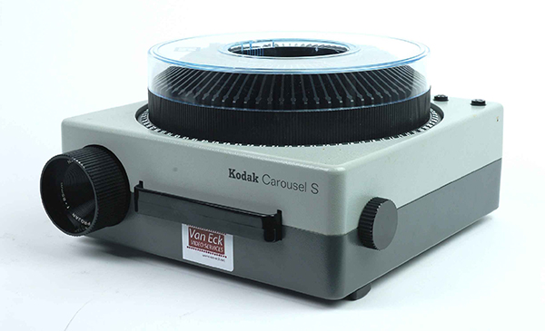 An image of a carousel slide projector represents the additional slides and presentations available to TAs