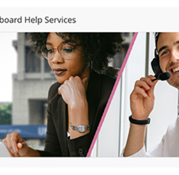 A smiling man with a telephone headset is happy to help an instructor with Blackboard. 